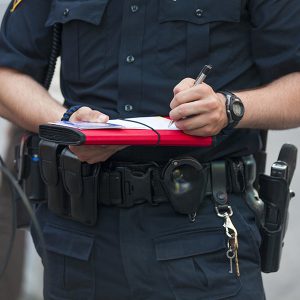 Traffic Ticket being written by an Officer